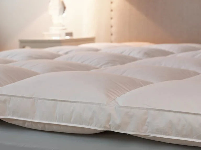 75-25 Feather and down mattress topper. Featherbed by Down Inc. A luxurious every day essential.