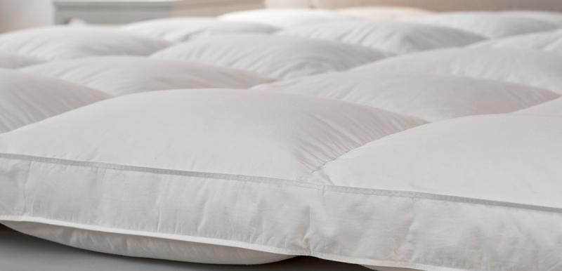 50-50 Feather-down mattress topper. Featherbed by Down Inc. A luxurious every day essential.